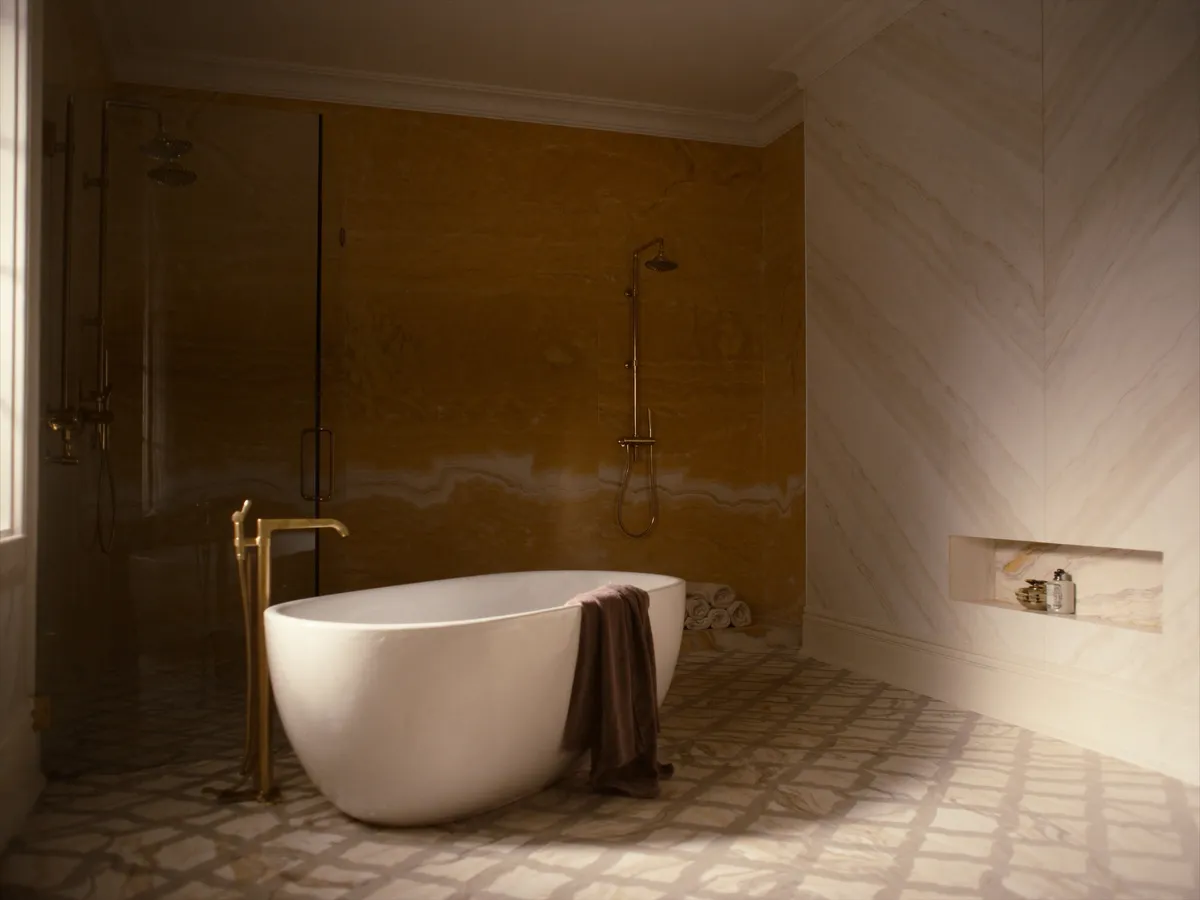Primary bathroom renovation in Angus Glen, Markham — bookmatched marble walls and freestanding sculptural tub