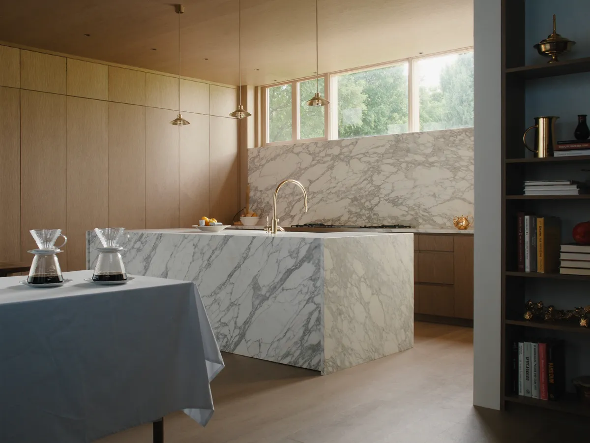 Fully renovated luxury kitchen with marble waterfall island in a Rosedale, Toronto home renovation